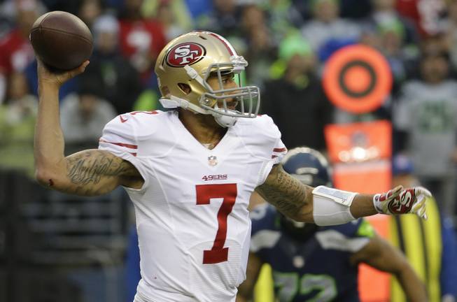 San Francisco 49ers quarterback Colin Kaepernick throws during the first half of the NFL football NFC Championship game against the Seattle Seahawks, Sunday, Jan. 19, 2014, in Seattle. 